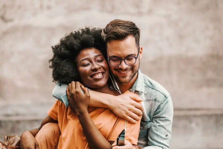 A man hugging a woman