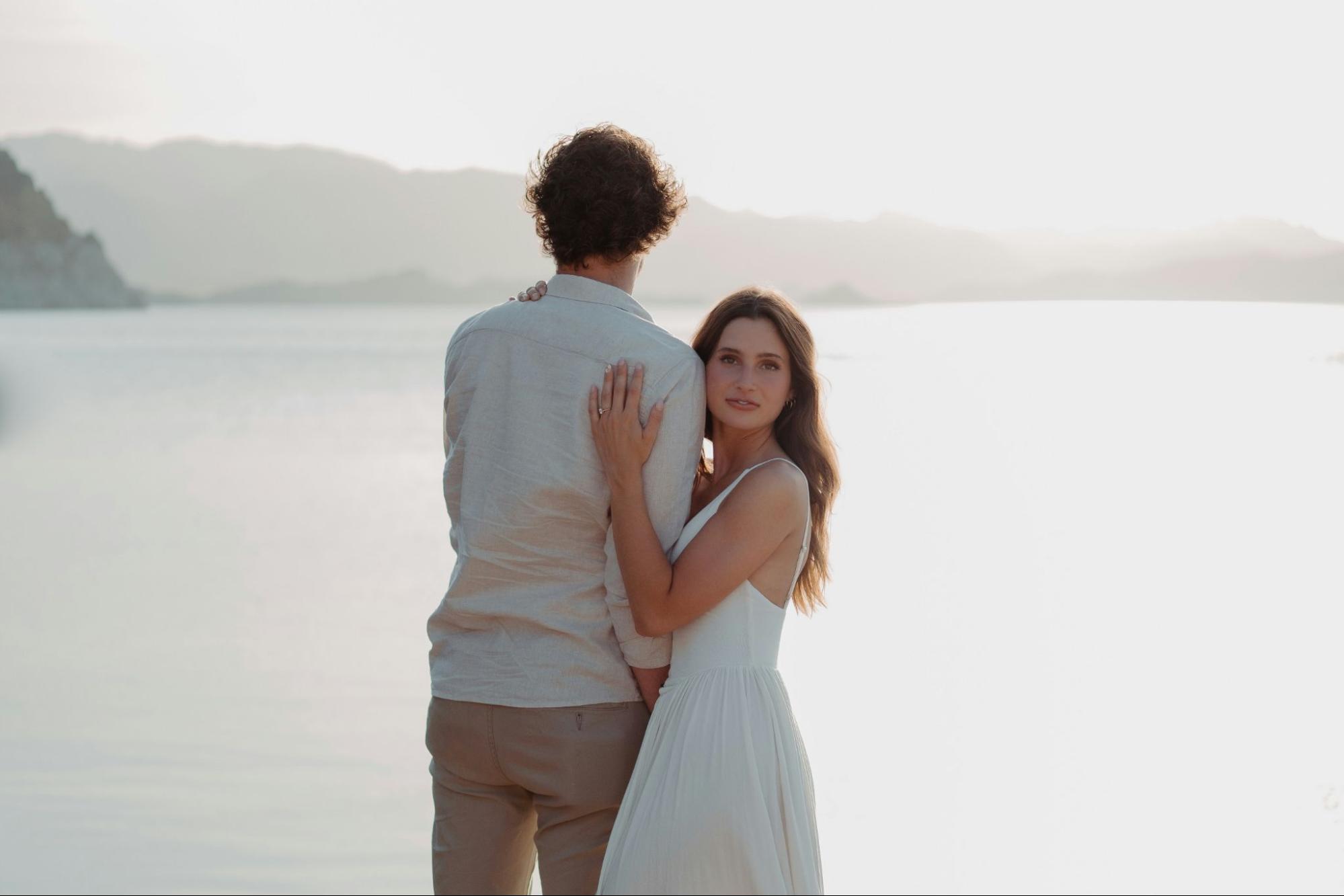 A woman hugging a man