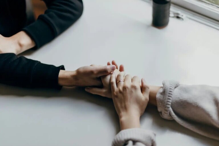 Couple holding hands