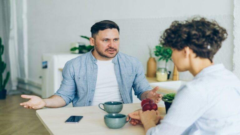A man and a woman having a serious conversation