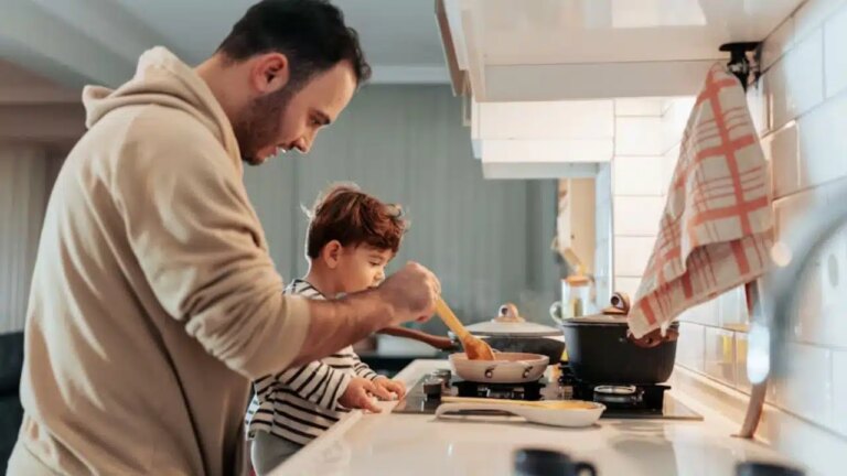 House husband preparing dinner with a calm and proud expression