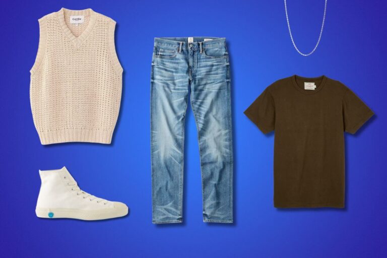 men's fall outfit flat lay featuring a sweater vest, blue jeans, brown t-shirt, white high top sneakers and a chain necklace